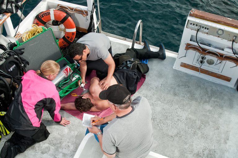 First Aid being performed on a boat on the water
